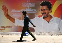 How CM Vijay Built His Political Foundation from a Fan Movement Tamil Nadu Chief Minister Vijay addressing a political rally surrounded by supporters holding TVK party flags