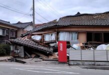 Japan Earthquake: 7.1 Magnitude Quake Hits Kyushu Japan earthquake aftermath in Kumamoto, emergency teams inspect damaged roads after the 7.1 magnitude quake.