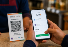 Will You Pay for UPI Now? Government Paves Way for Merchant Fees Above Rs 2,000 Indian smartphone making a UPI QR code payment through a bank account